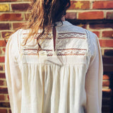 feminine woven long sleeve mock neck top styled for boho elegance