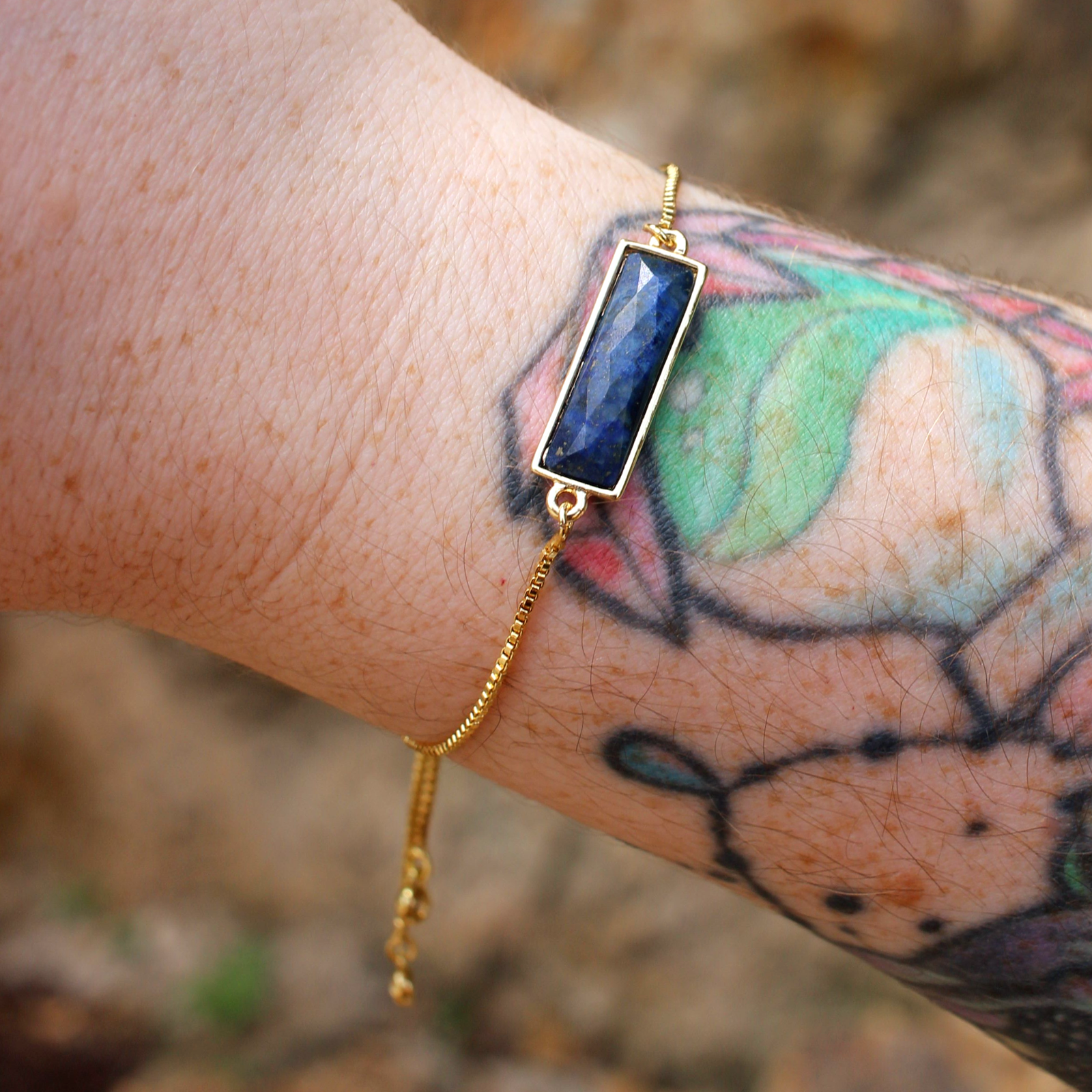 Someone wearing the Lapis 22kt Gold Overlay Adjustable Bracelet.