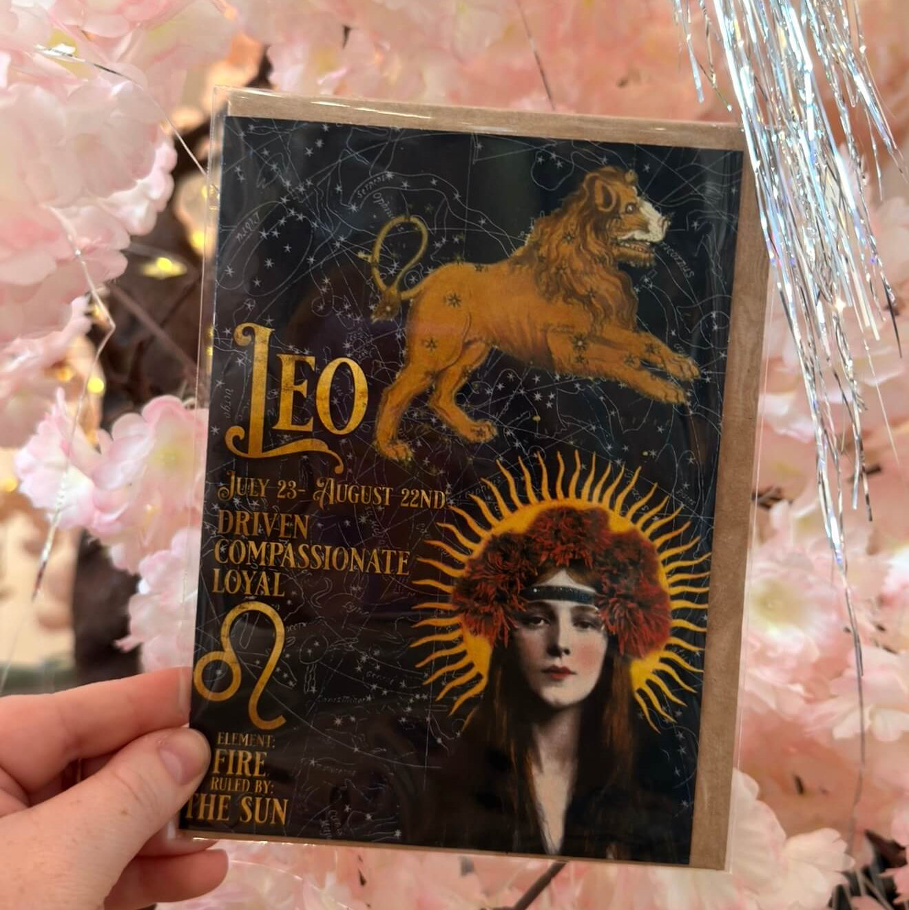 Vintage Leo zodiac greeting card with lion, celestial star map and astrology artwork