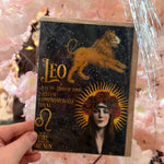 Vintage Leo zodiac greeting card with lion, celestial star map and astrology artwork