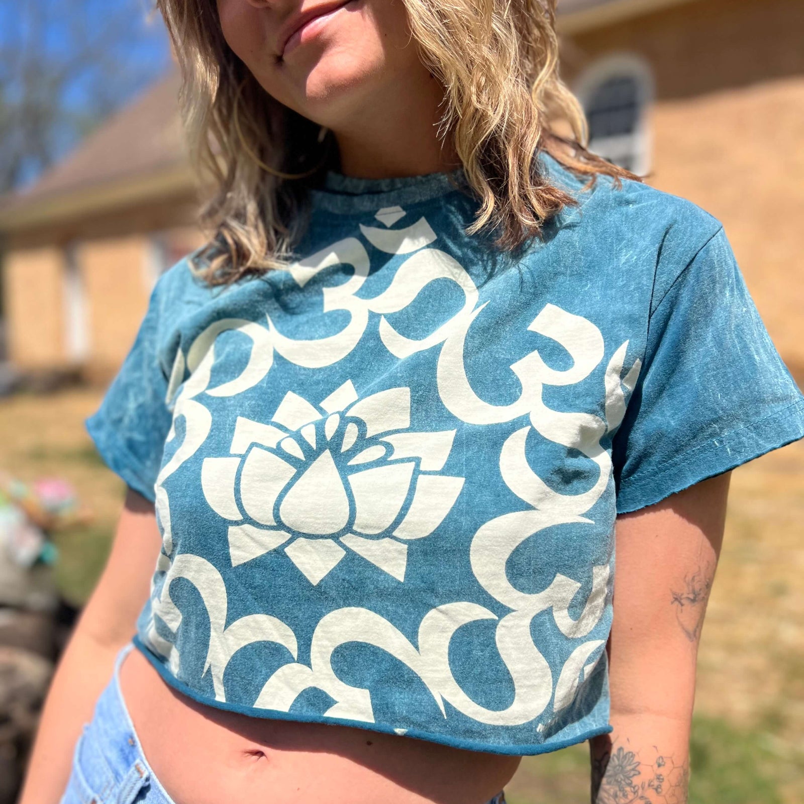 Boho crop top featuring Om symbol and lotus design on soft cotton fabric