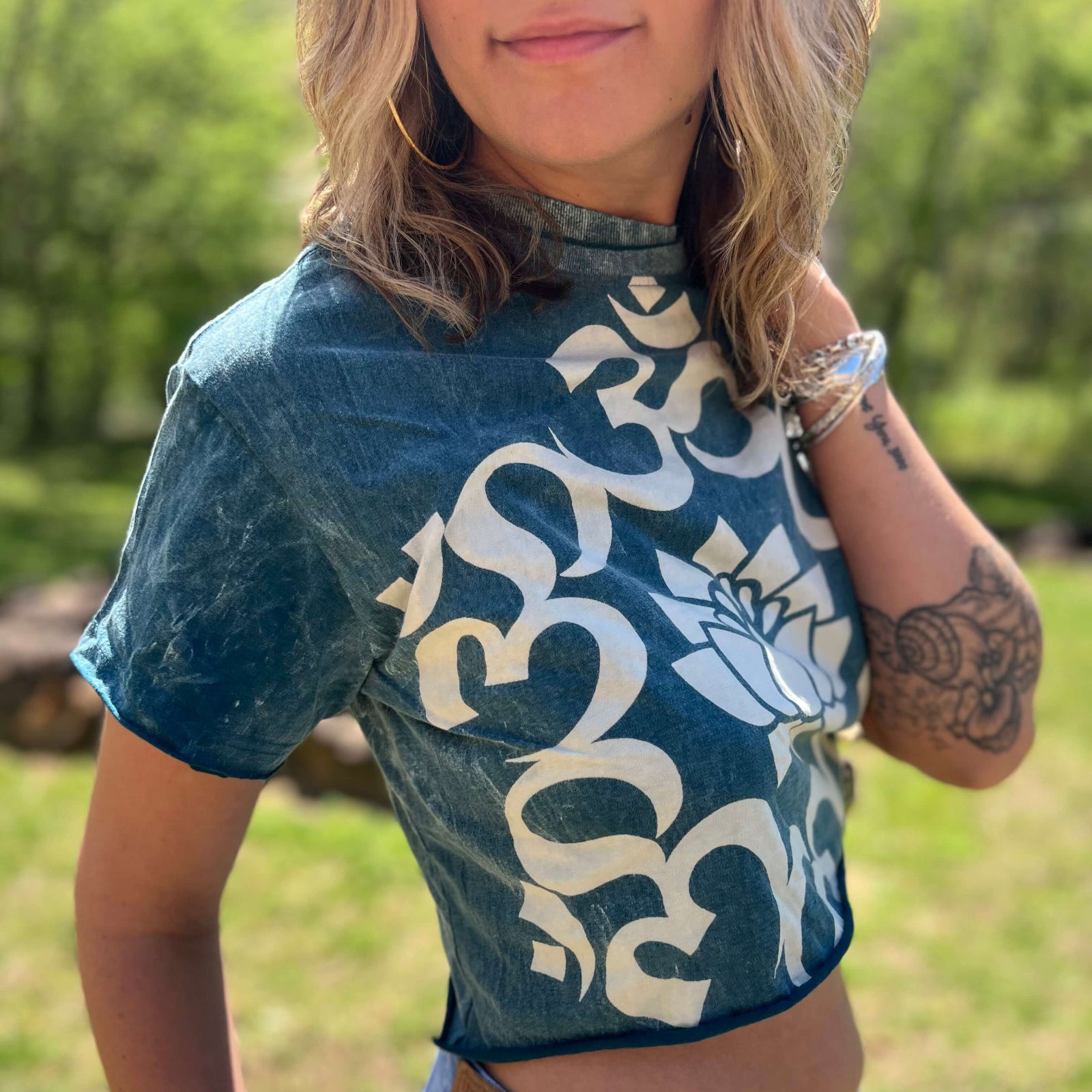 Casual boho outfit featuring Om lotus crop top and relaxed shorts