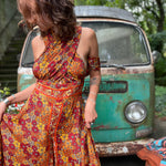 Plus size model in colorful bohemian silk wide leg jumpsuit
