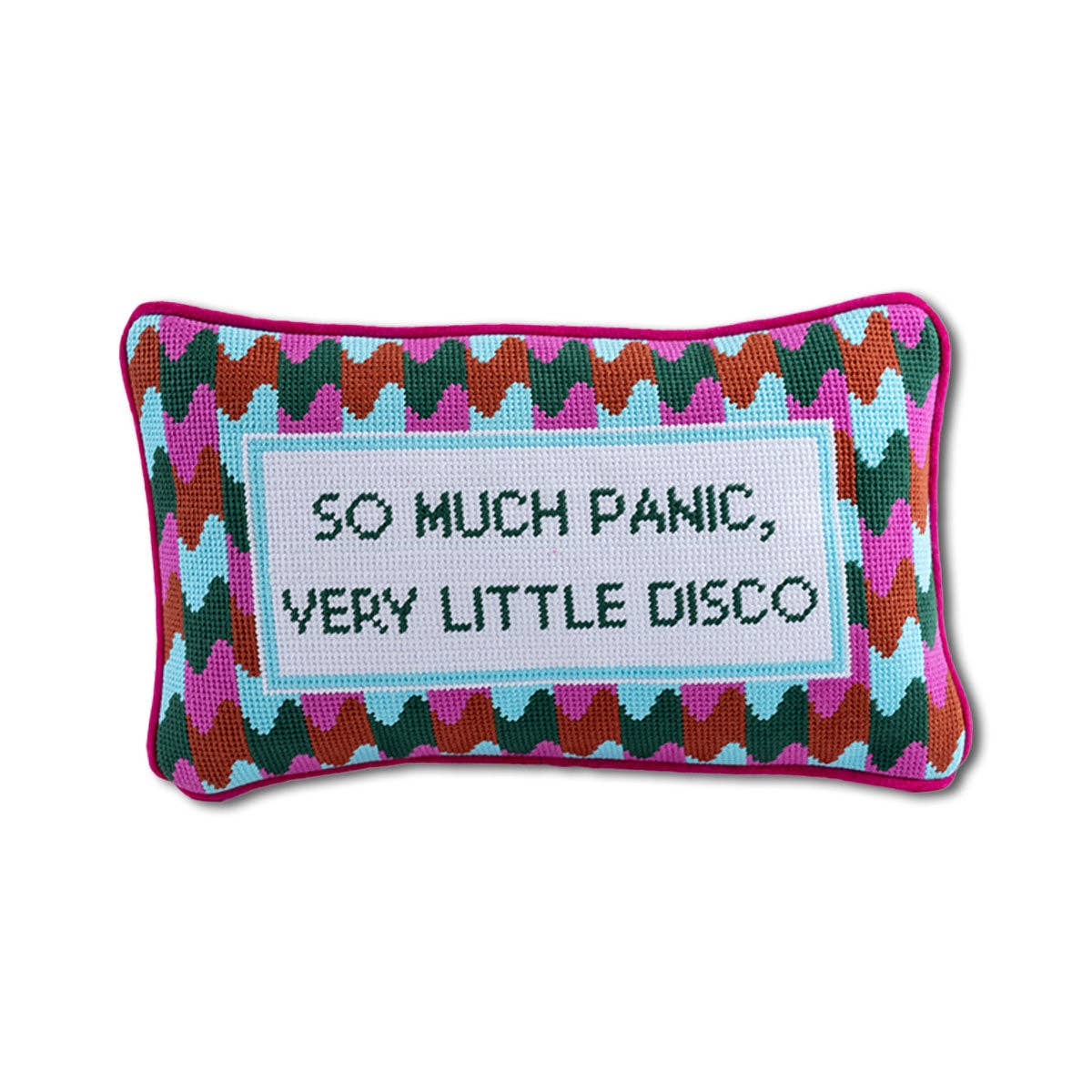 Close-up of needlepoint pillow with embroidered retro disco quote and textured stitching