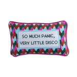 Close-up of needlepoint pillow with embroidered retro disco quote and textured stitching
