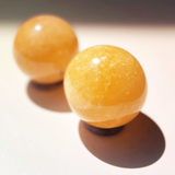 orange calcite crystal sphere creamsicle pattern polished crystal ball