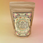 Front view of ZenBunni Biodynamic Coffee bag against a dreamy gradient background