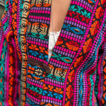 Button closure on handmade hippie boho trench coat