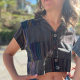 Close-up of wooden buttons on striped crop top