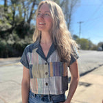 patchwork cropped blouse with denim colors on model