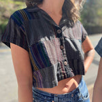 Model in pastel cropped striped blouse with buttons