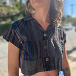 Model wearing charcoal patchwork cropped blouse