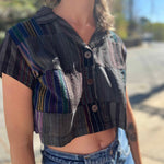 up close look at patchwork cropped blouse on model with 3 wooden buttons