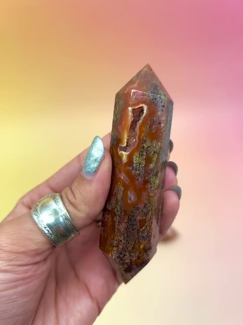 red moss agate on an orange background