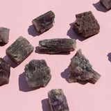 Mineral samples on a pink background