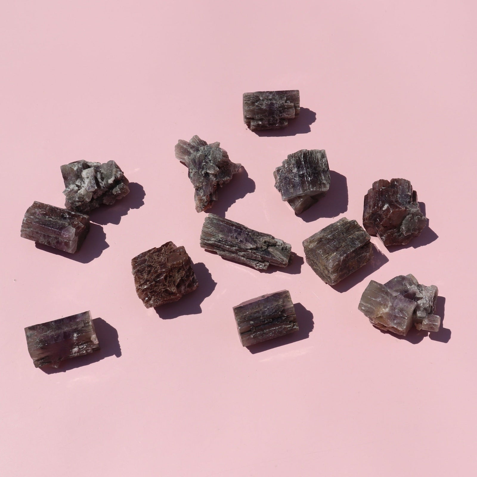 Mineral samples on a pink background