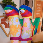 Close up of peep toe detail on rainbow suede pumps.