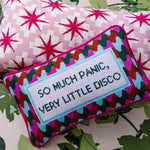 Retro disco needlepoint throw pillow styled as a bold statement home decor accent