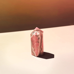 Pink rhodochrosite crystal tower with natural banding polished obelisk stone for emotional healing