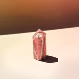 Pink rhodochrosite crystal tower with natural banding polished obelisk stone for emotional healing