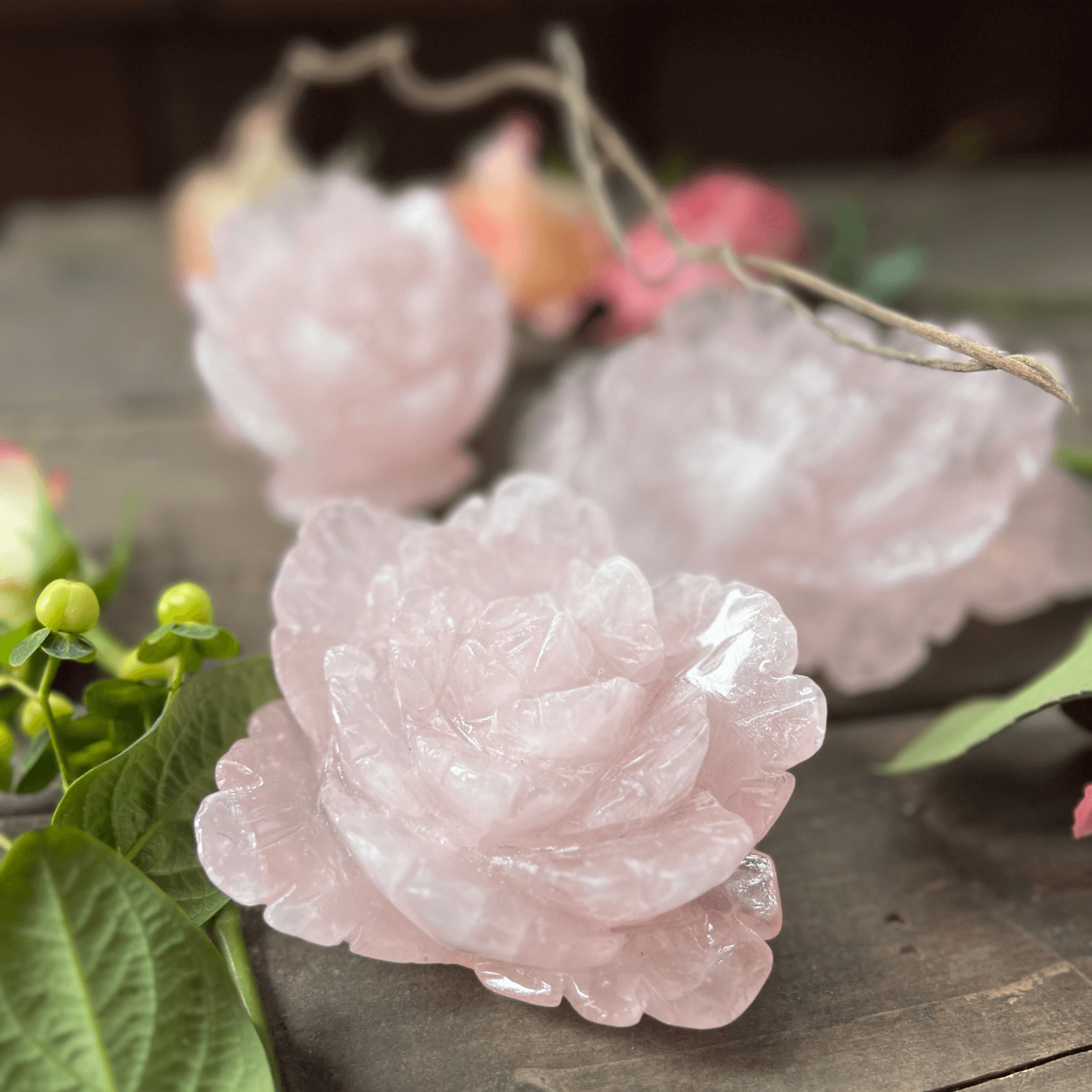 Hand carved rose quartz rose crystal representing unconditional love and heart chakra energy