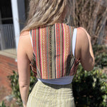 Rustic stripe fitted cotton vest - model turning to show back pattern detail of vest