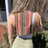 Rustic stripe fitted cotton vest - model turning to show back pattern detail of vest