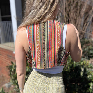 Rustic stripe fitted cotton vest - model turning to show back pattern detail of vest