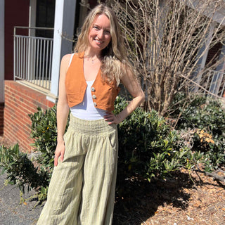 Rustic stripe fitted cotton vest - model standing confidently in rustic vest and boho pants