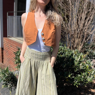 Rustic stripe fitted cotton vest - model walking in rustic cotton vest on sunny day