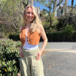 Rustic stripe fitted cotton vest - model outdoors showing vest with wide-leg pants and sandals