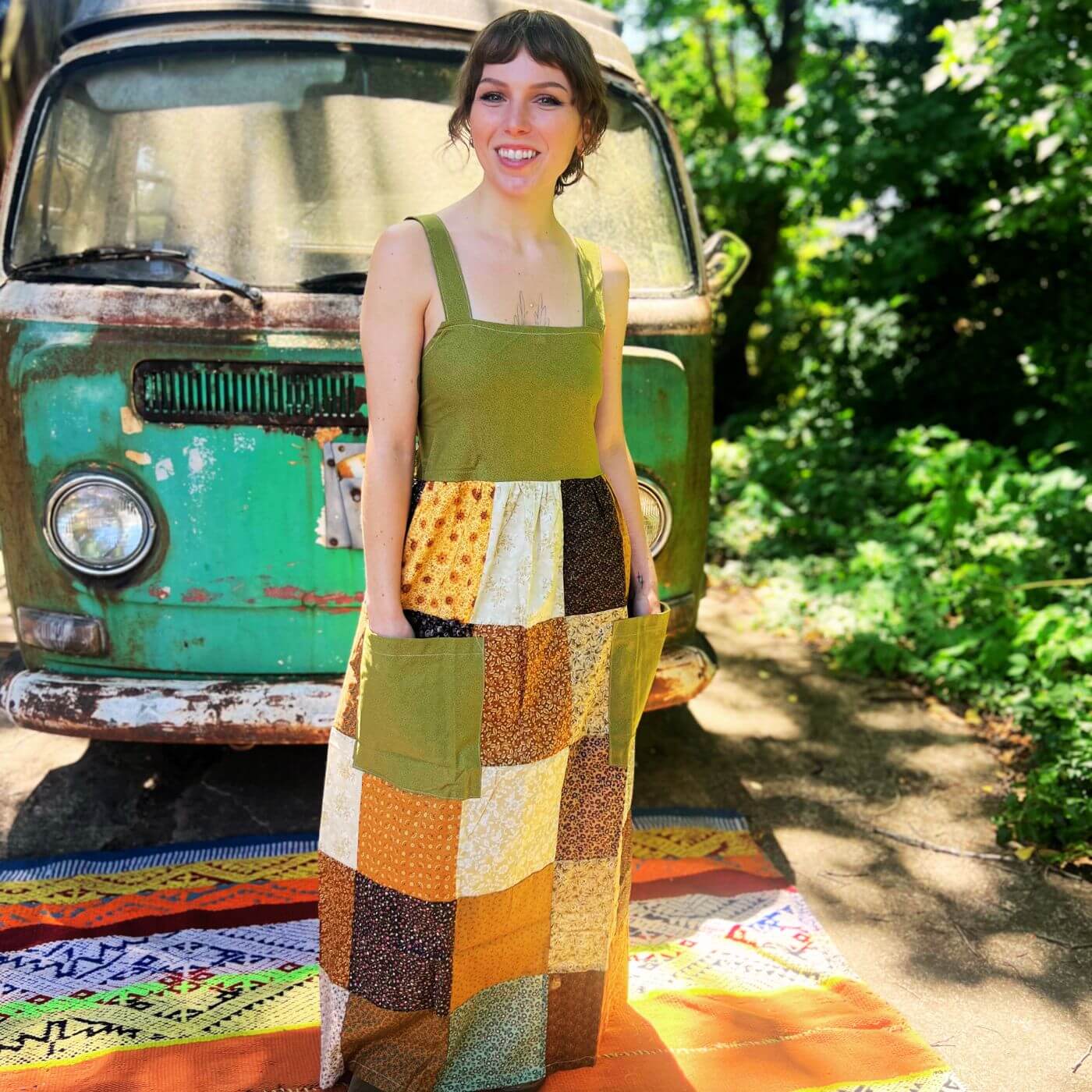 Earthy sage green bohemian patchwork dress with flowing silhouette
