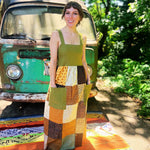 Earthy sage green bohemian patchwork dress with flowing silhouette