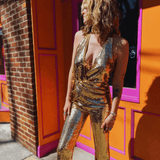 Close up of gold sequin halter neckline jumpsuit