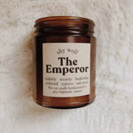 The Emperor candle on a white fluffy surface.