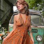 Close-up of tiered silk fabric detail on boho maxi dress