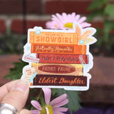 Close-up of Taylor Swift inspired Showgirl sticker in orange, red, and gold tones.