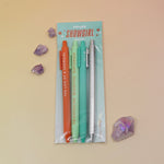 Set of three pens in a clear package with 'Showgirl' branding on a beige background.