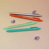 Four Taylor-inspired pens with phrases including The Life of a Showgirl, TS12, and And Baby That’s Showbiz.