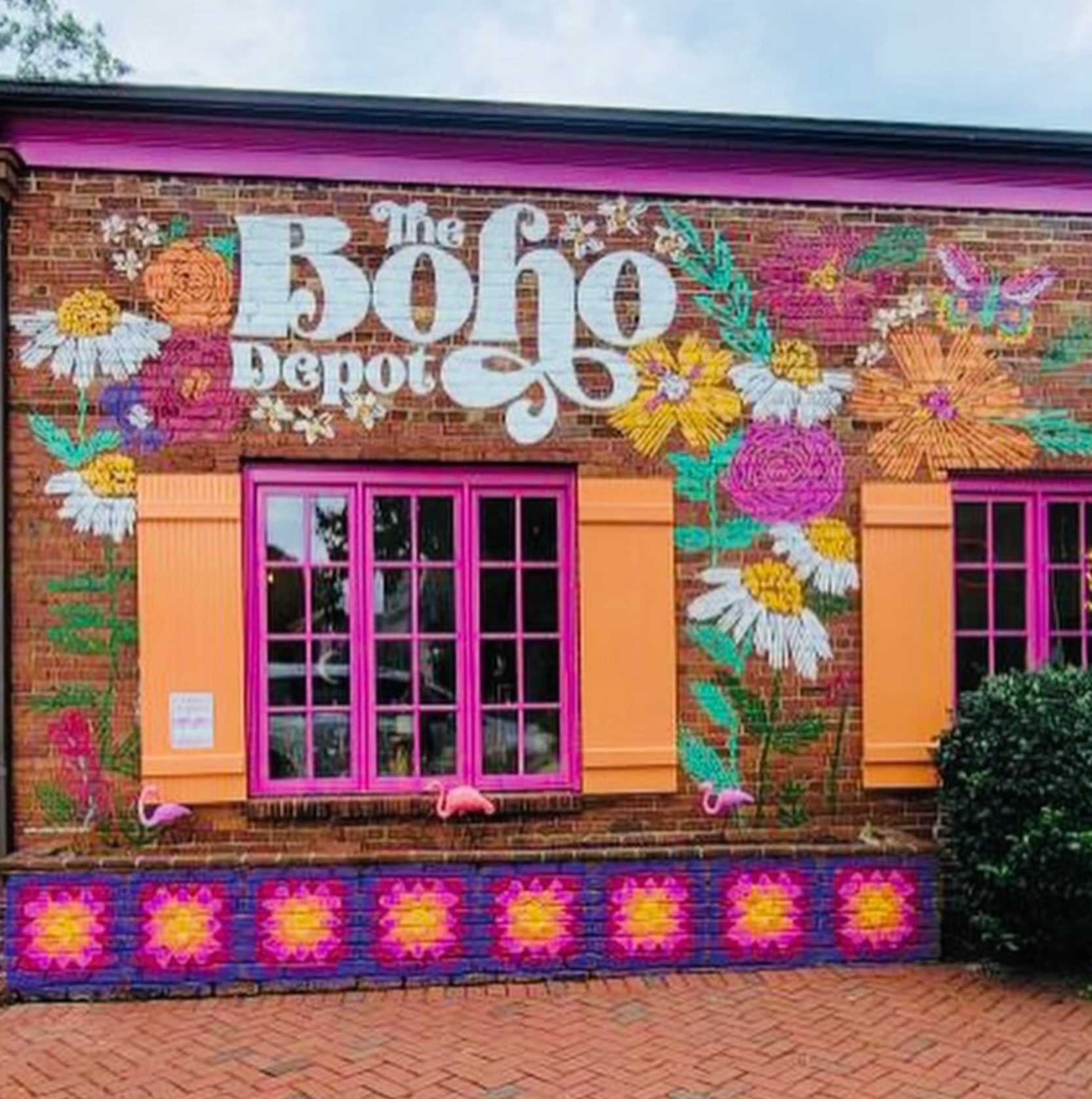 Colorful mural and boutique exterior of The Boho Depot in Winston-Salem’s West End shopping district.