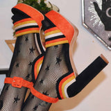 Orange, yellow, and black suede pumps for Halloween outfits.