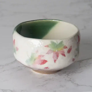 The Momiji Japanese Maple Mini Matcha Bowl on a white marble background.