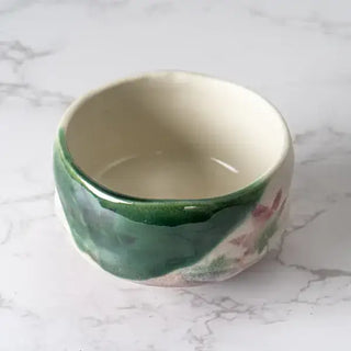 The Momiji Japanese Maple Mini Matcha Bowl on a white marble background.