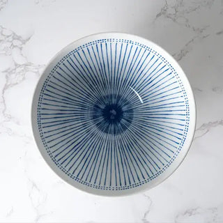 The Ten Tokusa Porcelain Ramen Bowl on a white marble background.