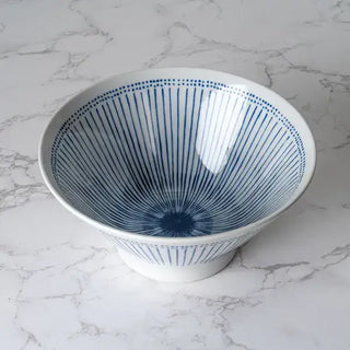 The Ten Tokusa Porcelain Ramen Bowl on a white marble background.