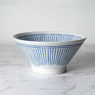 The Ten Tokusa Porcelain Ramen Bowl on a white marble background.