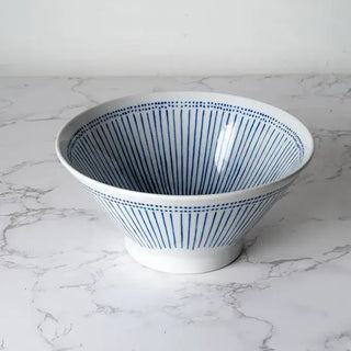 The Ten Tokusa Porcelain Ramen Bowl on a white marble background.