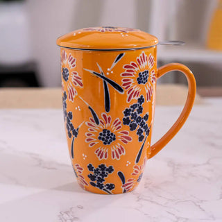 The Yellow Flower Design Tea Mugs with Lid and Infuser on a white marble background.