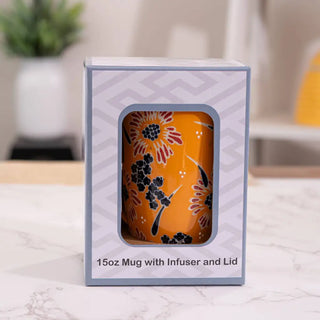 The Yellow Flower Design Tea Mugs with Lid and Infuser’s packaging on a white marble background.