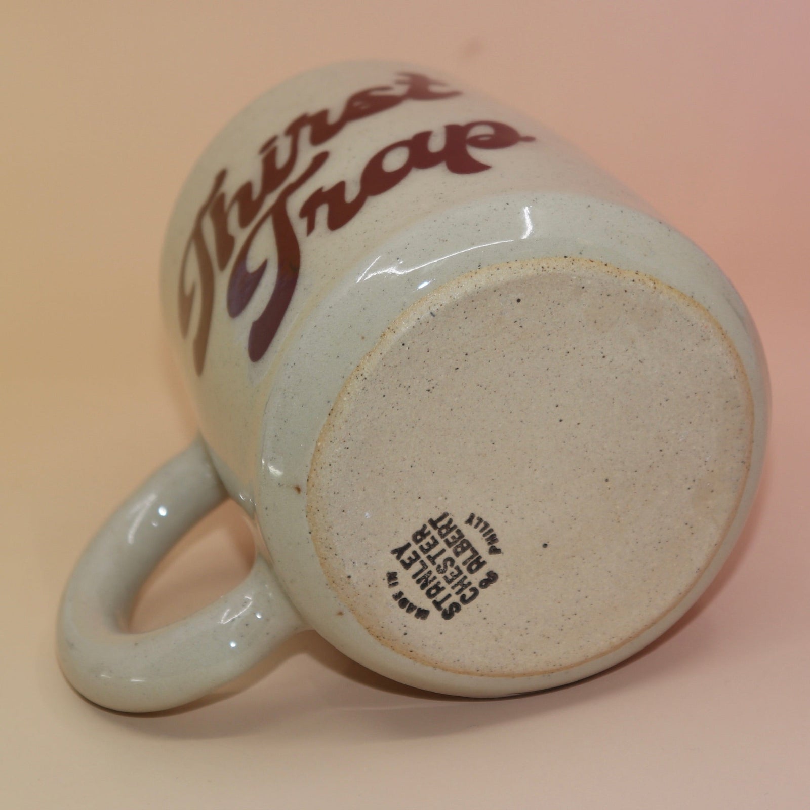 Underside of mug showing craftsmanship and natural glaze